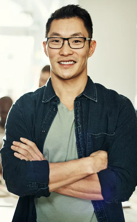 Small business owner smiling in his office