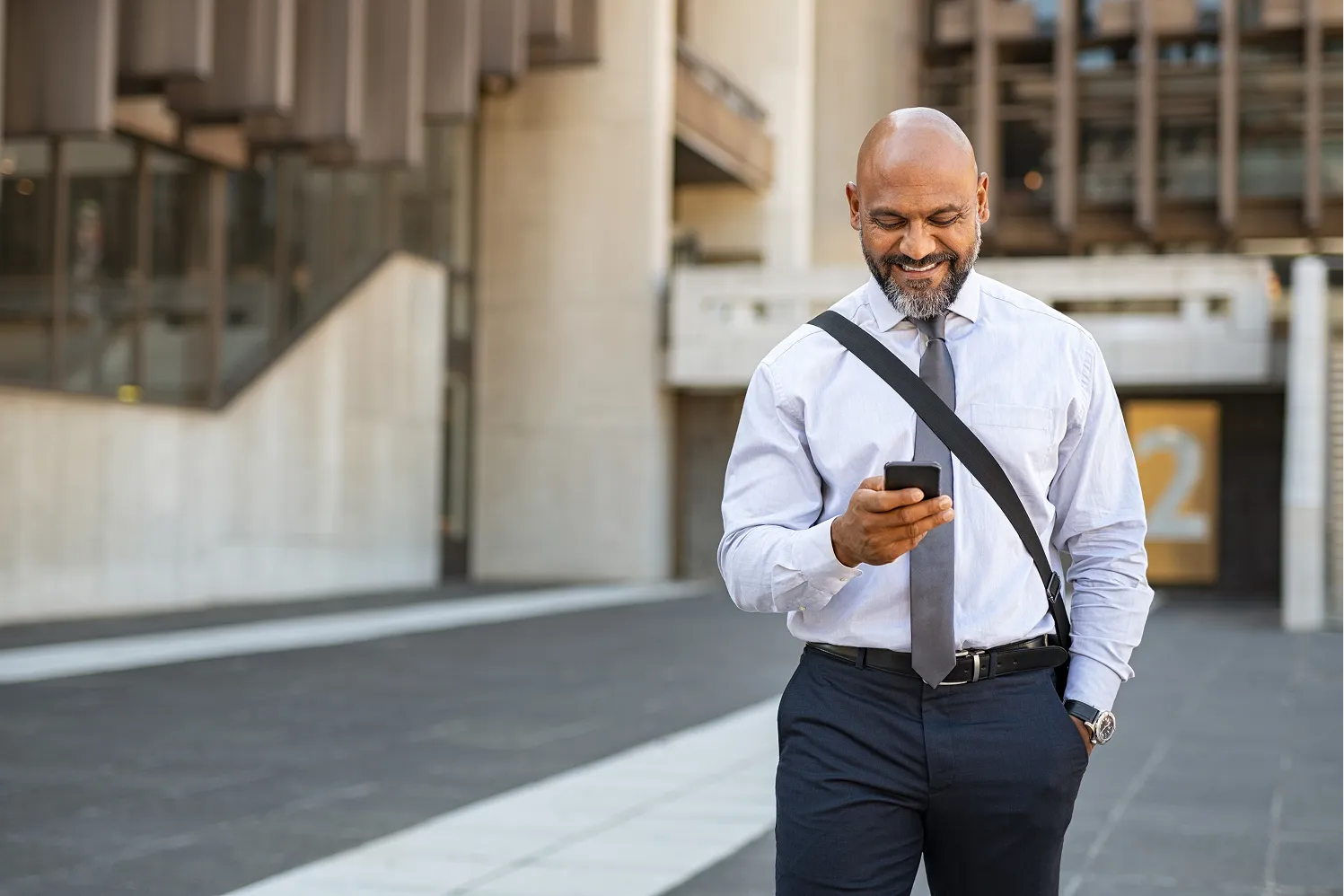 Business professional checking a loan update on a phone